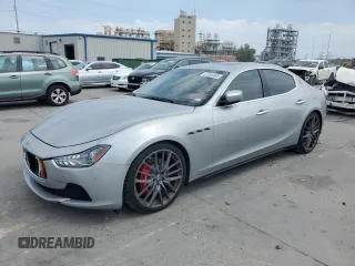 2015 Maserati Ghibli S Q4 with VIN ZAM57RTA0F1143572, listed as a Copart auction lot 57265465 with 77,602 mi miles and Salvage title. Bid and sale history available at DreamBid. Image 1.