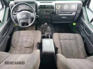 2004 Jeep Wrangler SE with VIN 1J4FA29124P769475, listed as a Copart auction lot 64371244 with 136,877 mi miles and Salvage title. Bid and sale history available at DreamBid. Image 8.