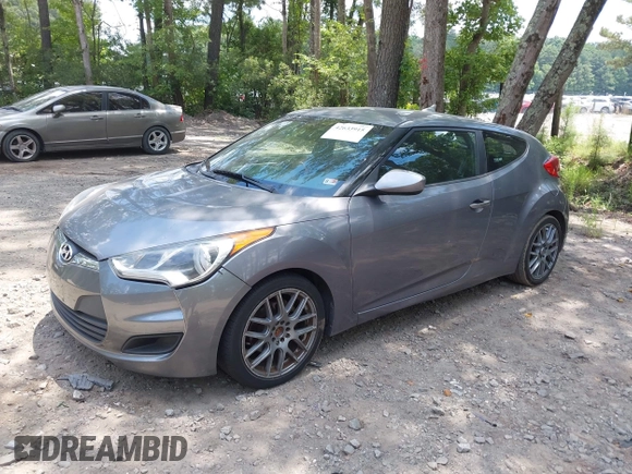 2012 Hyundai Veloster w/Black Int with VIN KMHTC6AD3CU078547, listed as a IAAI auction lot 42633915 with 143,633 mi miles and . Bid and sale history available at DreamBid. Image 2.