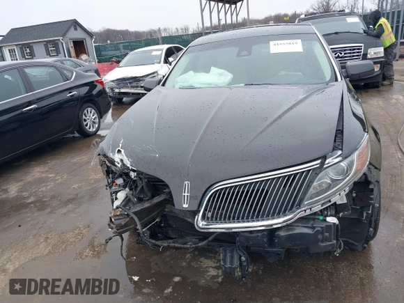 2014 Lincoln MKS with VIN 1LNHL9EK7EG609329, listed as a IAAI auction lot 41555819 with 89,849 mi miles. Bid and sale history available at carsss.com. Image 12.