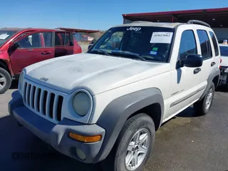 2002 Jeep Liberty Sport with VIN 1J8GL48KX2W153948, listed as a IAAI auction lot 41843882 with 180,677 mi miles. Bid and sale history available at carsss.com. Image 17.