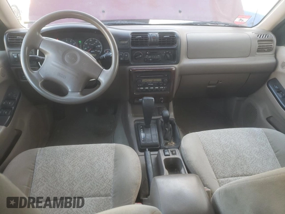 2002 Isuzu Rodeo S with VIN 4S2DM58W824313096, listed as a Copart auction lot 77951364 with 127,470 mi miles and Salvage Title. Bid and sale history available at DreamBid. Image 8.