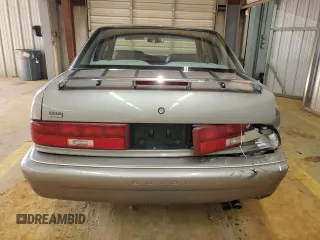 1996 Buick Regal Custom with VIN 2G4WB52KXT1523059, listed as a Copart auction lot 88440285 with 95,444 mi miles and Salvage title. Bid and sale history available at DreamBid. Image 6.