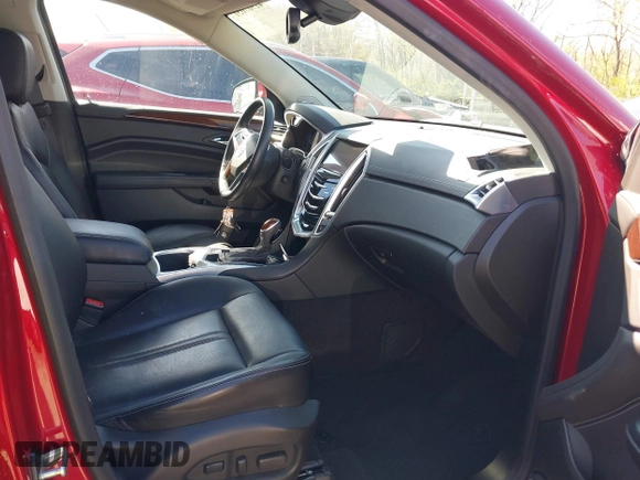 2014 Cadillac SRX Performance Collection with VIN 3GYFNCE34ES519563, listed as a IAAI auction lot 41967051 with 12,603 mi miles and . Bid and sale history available at carsss.com. Image 5.