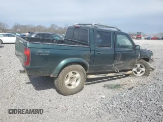 2000 Nissan Frontier XE with VIN 1N6ED27Y4YC382199, listed as a Copart auction lot 47127045 with 207,449 mi miles and Salvage title. Bid and sale history available at DreamBid. Image 3.