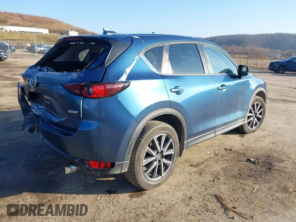 2018 Mazda CX-5 Touring z VIN JM3KFBCM2J0461954, wystawiony jako IAAI lot #41655865 z przebiegiem 129 333 mil mil oraz . Historia ofert i sprzedaży dostępna na DreamBid. Obrazek 4.