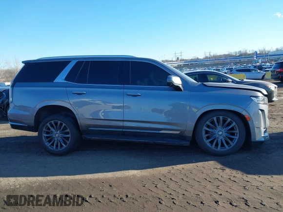 2021 Cadillac Escalade Premium Luxury z VIN 1GYS4CKL2MR231788, wystawiony jako IAAI lot #41630686 z przebiegiem 56 672 mil mil oraz . Historia ofert i sprzedaży dostępna na DreamBid. Obrazek 13.