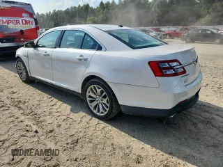 2013 Ford Taurus Limited with VIN 1FAHP2F88DG102737, listed as a Copart auction lot 63327915 with 87,009 mi miles and Salvage title. Bid and sale history available at DreamBid. Image 2.