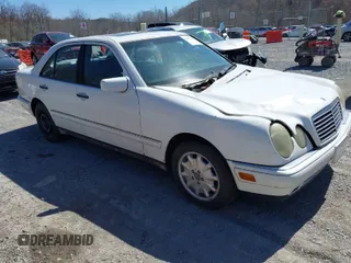 1999 Mercedes-Benz E-Class with VIN WDBJF82H4XX025925, listed as a IAAI auction lot 41839398 with 238,583 mi miles. Bid and sale history available at carsss.com. Image 1.