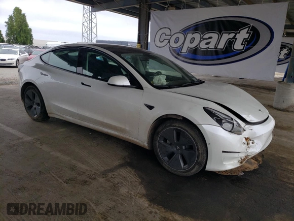2022 Tesla Model 3 Long Range with VIN 5YJ3E1EB2NF267485, listed as a Copart auction lot 54952505 with 30,569 mi miles and Clean Title. Bid and sale history available at DreamBid. Image 4.