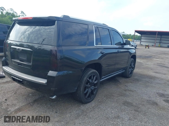 2015 Chevrolet Tahoe LTZ with VIN 1GNSCCKC5FR103676, listed as a IAAI auction lot 42456913 with 214,009 mi miles and . Bid and sale history available at DreamBid. Image 4.