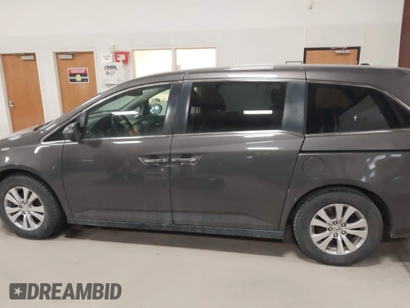 2015 Honda Odyssey EX-L with VIN 5FNRL5H64FB055890, listed as a IAAI auction lot 41706141 with 155,167 mi miles and . Bid and sale history available at carsss.com. Image 14.