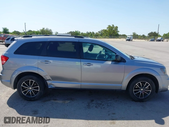 2017 Dodge Journey SE z VIN 3C4PDCAB1HT573511, wystawiony jako IAAI lot #41984865 z przebiegiem 128 721 mil mil oraz . Historia ofert i sprzedaży dostępna na DreamBid. Obrazek 13.