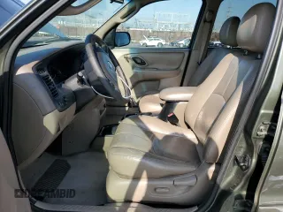 2002 Mazda Tribute LX with VIN 4F2YU08112KM16716, listed as a Copart auction lot 55095645 with 113,885 mi miles and Salvage Title. Bid and sale history available at DreamBid. Image 7.