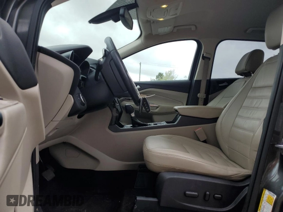 2017 Ford Escape Titanium with VIN 1FMCU0J98HUF09588, listed as a Copart auction lot 48988765 with 101,887 mi miles and Salvage Title. Bid and sale history available at DreamBid. Image 7.