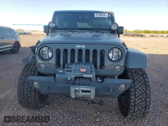 2014 Jeep Wrangler Unlimited Rubicon with VIN 1C4HJWFG9EL199501, listed as a Copart auction lot 61443595 with 86,940 mi miles and Salvage title. Bid and sale history available at DreamBid. Image 5.