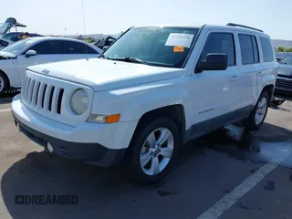 2011 Jeep Patriot Latitude with VIN 1J4NT1GB5BD245263, listed as a IAAI auction lot 41942376 with 215,147 mi miles. Bid and sale history available at carsss.com. Image 2.