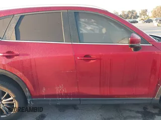 2020 Mazda CX-5 Touring z VIN JM3KFACM1L0855474, wystawiony jako IAAI lot #42004504 z przebiegiem 82 505 mil mil oraz . Historia ofert i sprzedaży dostępna na DreamBid. Obrazek 13.
