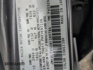 2011 Mazda 3 i Touring with VIN JM1BL1VGXB1389786, listed as a Copart auction lot 55629525 with 162,180 mi miles and Salvage Title. Bid and sale history available at DreamBid. Image 12.