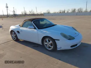 1999 Porsche Boxster z VIN WP0CA2980XU624415, wystawiony jako IAAI lot #41759004 z przebiegiem 131 200 mil mil oraz . Historia ofert i sprzedaży dostępna na DreamBid. Obrazek 1.