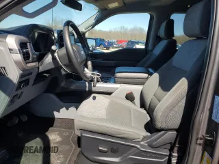 2023 Ford F-150 Lightning Pro with VIN 1FTVW1EL8PWG10894, listed as a Copart auction lot 50988655 with 34,020 mi miles and Salvage Title. Bid and sale history available at DreamBid. Image 7.