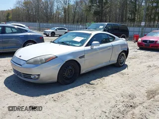 2008 Hyundai Tiburon GT z VIN KMHHN66F98U294081, wystawiony jako IAAI lot #41879165 z przebiegiem 205 253 mil mil oraz . Historia ofert i sprzedaży dostępna na DreamBid. Obrazek 2.