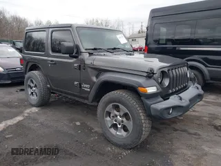 2021 Jeep Wrangler Sport z VIN 1C4GJXAN2MW541827, wystawiony jako IAAI lot #42037130 z przebiegiem 55 484 mil mil oraz . Historia ofert i sprzedaży dostępna na DreamBid. Obrazek 1.
