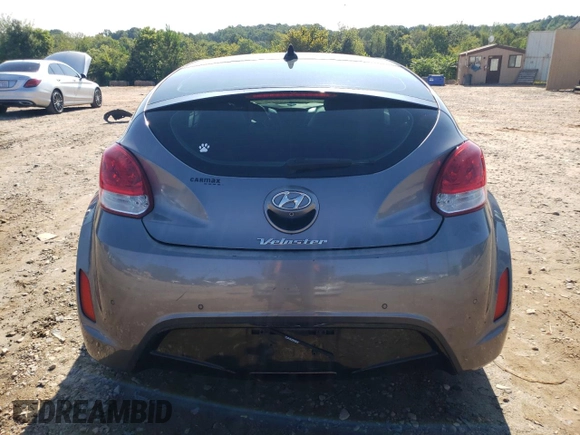 2016 Hyundai Veloster with VIN KMHTC6AD7GU248608, listed as a Copart auction lot 65809693 with 104,784 mi miles. Bid and sale history available at carsss.com. Image 6.