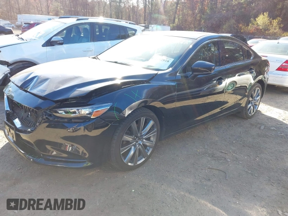 2018 Mazda 6 Grand Touring with VIN JM1GL1TY0J1319083, listed as a IAAI auction lot 40852818 with 57,408 mi miles and . Bid and sale history available at DreamBid. Image 17.