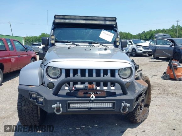 2013 Jeep Wrangler Unlimited Sahara with VIN 1C4BJWEG4DL666930, listed as a IAAI auction lot 42310569 with 206,577 mi miles and . Bid and sale history available at DreamBid. Image 12.