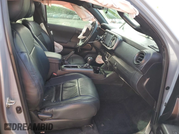2020 Toyota Tacoma SR5 with VIN 3TMDZ5BN6LM097302, listed as a Copart auction lot 57503895 with 77,212 mi miles and Salvage title. Bid and sale history available at DreamBid. Image 7.