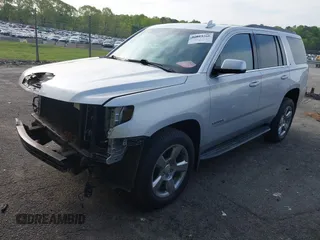 2019 Chevrolet Tahoe LT with VIN 1GNSCBKCXKR219413, listed as a IAAI auction lot 42013260 with 92,886 mi miles and . Bid and sale history available at DreamBid. Image 19.