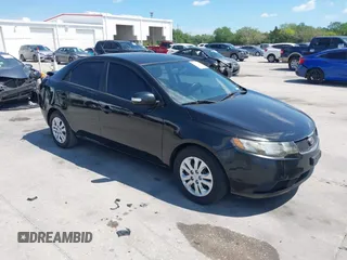 2010 Kia Forte EX with VIN KNAFU4A20A5847351, listed as a IAAI auction lot 41897921 with 129,084 mi miles. Bid and sale history available at carsss.com. Image 1.