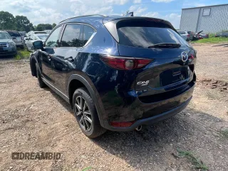 2018 Mazda CX-5 Grand Touring with VIN JM3KFBDMXJ1391984, listed as a Copart auction lot 65138665 with 97,244 mi miles and Clean title. Bid and sale history available at DreamBid. Image 3.