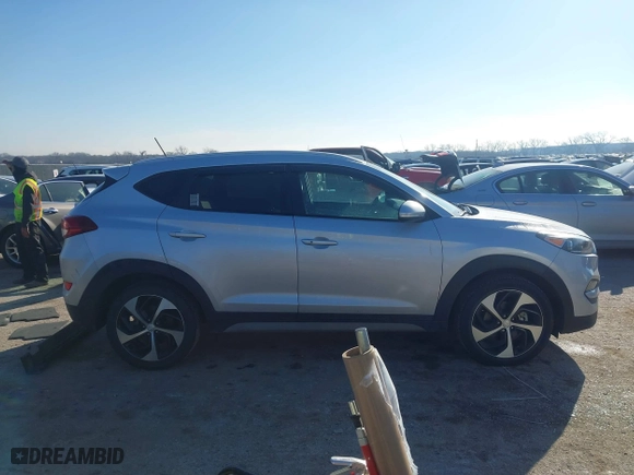 2017 Hyundai Tucson Value with VIN KM8J33A22HU457809, listed as a IAAI auction lot 41632652 with 26,154 mi miles. Bid and sale history available at carsss.com. Image 13.