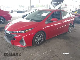 2021 Toyota Prius LE with VIN JTDKAMFP6M3189145, listed as a IAAI auction lot 42021116 with 80,722 mi miles and . Bid and sale history available at DreamBid. Image 2.