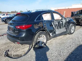 2014 Infiniti QX70 with VIN JN8CS1MU2EM451932, listed as a IAAI auction lot 41439834 with 125,781 mi miles and . Bid and sale history available at DreamBid. Image 4.