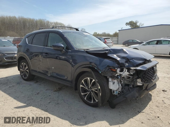 2022 Mazda CX-5 2.5 S Premium Package with VIN JM3KFBDMXN0559814, listed as a Copart auction lot 50985535 with 34,612 mi miles and Salvage Title. Bid and sale history available at carsss.com. Image 4.