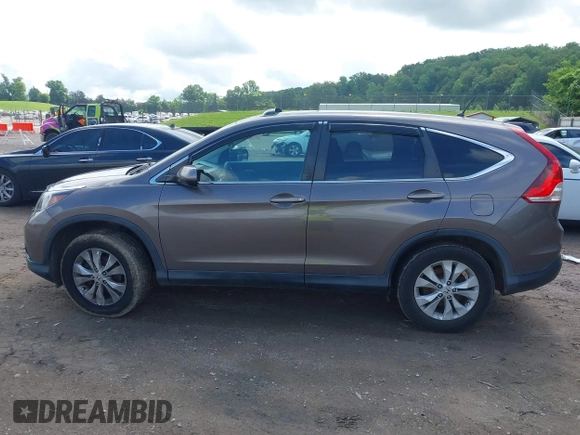 2014 Honda CR-V EX z VIN 2HKRM4H58EH621063, wystawiony jako IAAI lot #42253838 z przebiegiem 119 046 mil mil oraz . Historia ofert i sprzedaży dostępna na DreamBid. Obrazek 14.