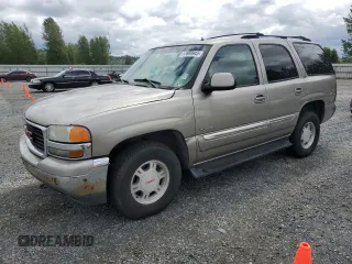 2002 GMC Yukon SLT z VIN 1GKEC13T32R245497, wystawiony jako Copart lot #57698945 z przebiegiem 298 942 mil mil oraz Czysty tytuł • Clean title. Historia ofert i sprzedaży dostępna na DreamBid. Obrazek 1.