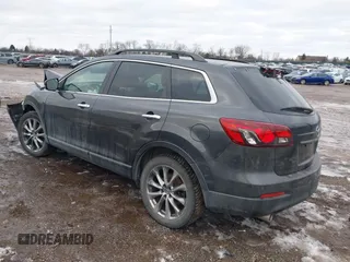 2015 Mazda CX-9 Grand Touring with VIN JM3TB2DAXF0447537, listed as a IAAI auction lot 41191694 with 157,113 mi miles. Bid and sale history available at carsss.com. Image 3.