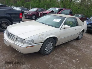 2002 Cadillac Eldorado ESC with VIN 1G6EL12Y92B100940, listed as a IAAI auction lot 42094683 with 146,859 mi miles. Bid and sale history available at carsss.com. Image 2.
