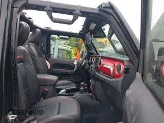 2021 Jeep Wrangler Unlimited Rubicon with VIN 1C4HJXFG7MW662092, listed as a IAAI auction lot 42139521 with 32,055 mi miles and . Bid and sale history available at carsss.com. Image 5.