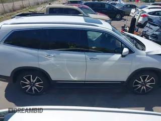 2021 Honda Pilot Touring 8-Passenger z VIN 5FNYF6H94MB087593, wystawiony jako IAAI lot #42153310 z przebiegiem 30 400 mil mil oraz . Historia ofert i sprzedaży dostępna na DreamBid. Obrazek 13.