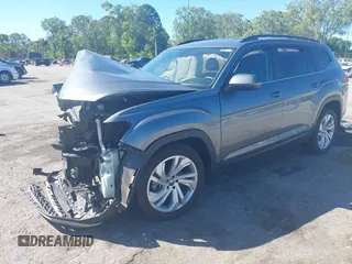 2021 Volkswagen Atlas SE z VIN 1V2WR2CA3MC602149, wystawiony jako IAAI lot #41845288 z przebiegiem 59 941 mil mil oraz . Historia ofert i sprzedaży dostępna na DreamBid. Obrazek 2.