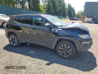 2017 Jeep Compass Trailhawk with VIN 3C4NJDDBXHT668053, listed as a Copart auction lot 63032155 with 94,090 mi miles and Salvage title. Bid and sale history available at DreamBid. Image 4.