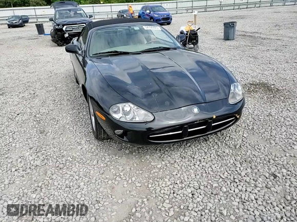 1999 Jaguar XK z VIN SAJGX2044XC031383, wystawiony jako Copart lot #54726925 z przebiegiem 107 696 mil mil oraz Szkody całkowita. Historia ofert i sprzedaży dostępna na DreamBid. Obrazek 13.