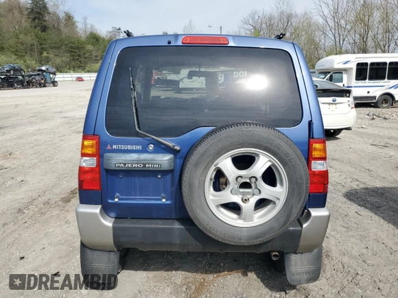 1999 Mitsubishi Montero z VIN H58A0013724, wystawiony jako Copart lot #52986435 z przebiegiem 88 711 mil mil oraz Szkoda całkowita • Salvage title. Historia ofert i sprzedaży dostępna na DreamBid. Obrazek 6.