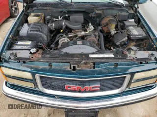 1996 GMC Suburban z VIN 1GKEC16R2TJ714191, wystawiony jako Copart lot #74660264 z przebiegiem 186 801 mil mil oraz Szkody całkowita. Historia ofert i sprzedaży dostępna na DreamBid. Obrazek 11.