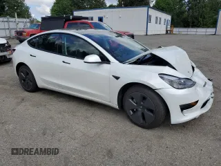 2023 Tesla Model 3 Long Range with VIN 5YJ3E1EB1PF603100, listed as a Copart auction lot 54945865 with 22,865 mi miles and Salvage Title. Bid and sale history available at DreamBid. Image 4.